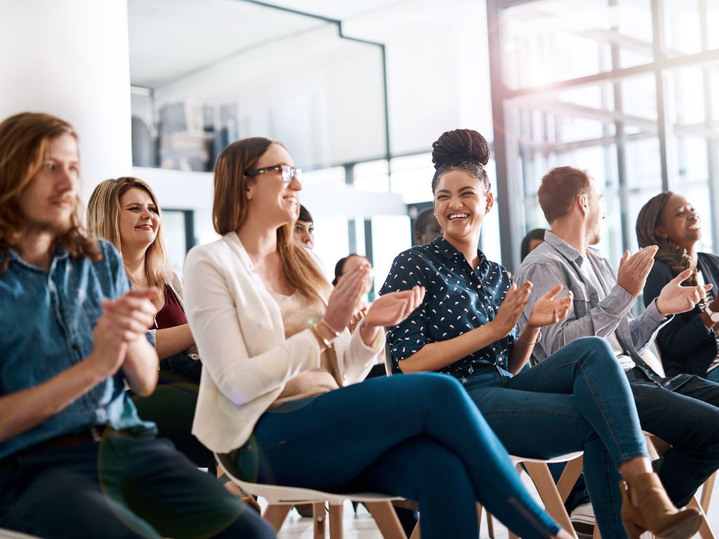 smiling employees during team meeting